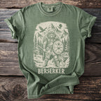 Green t-shirt with a graphic of a Viking warrior, a wolf, bear, and mountains.