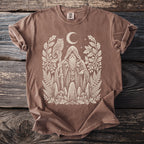 Brown t-shirt with a white graphic of a wizard, owl, moon, and forest elements.