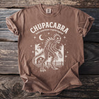Brown t-shirt with white Chupacabra graphic and text "latin american cryptid legend".