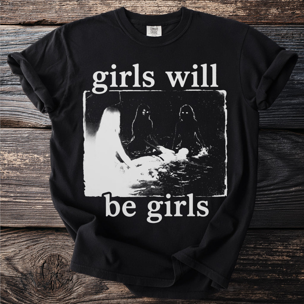 Black t-shirt with "girls will be girls" text and a gritty graphic of figures.