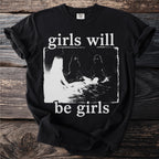 Black t-shirt with "girls will be girls" text and a gritty graphic of figures.