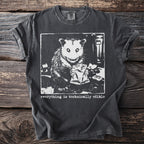 Opossum holding a bag of chips on a dark gray t-shirt with text.