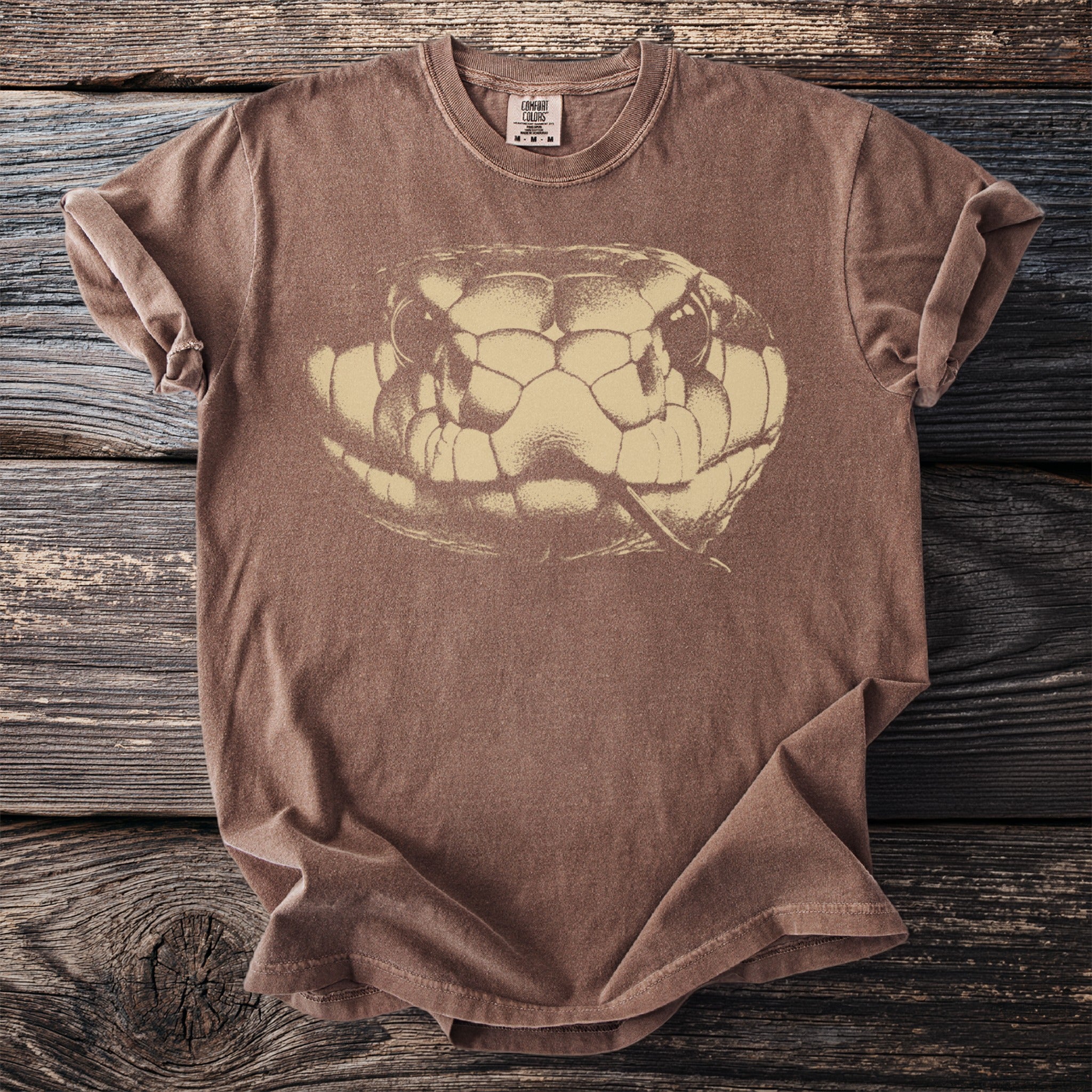 Brown t-shirt with a sepia-tone close-up graphic of a snake's head.