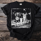 Dachshund and tabby cat sit with a to-go cup in a gritty urban setting.