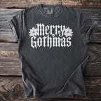 Dark gray t-shirt with white "Merry Gothmas" text and skull designs.