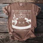 Brown t-shirt with "do not perceive me" text and a cat in a sink graphic.