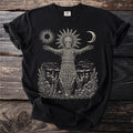 Black t-shirt with a wicker man figure, moon, sun, and figures holding candles.