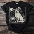 Golden retriever wearing a witch hat sits beside a carved pumpkin under a moonlit sky.