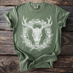 Green t-shirt with deer skull, skulls, roses, and thorny branches graphic.