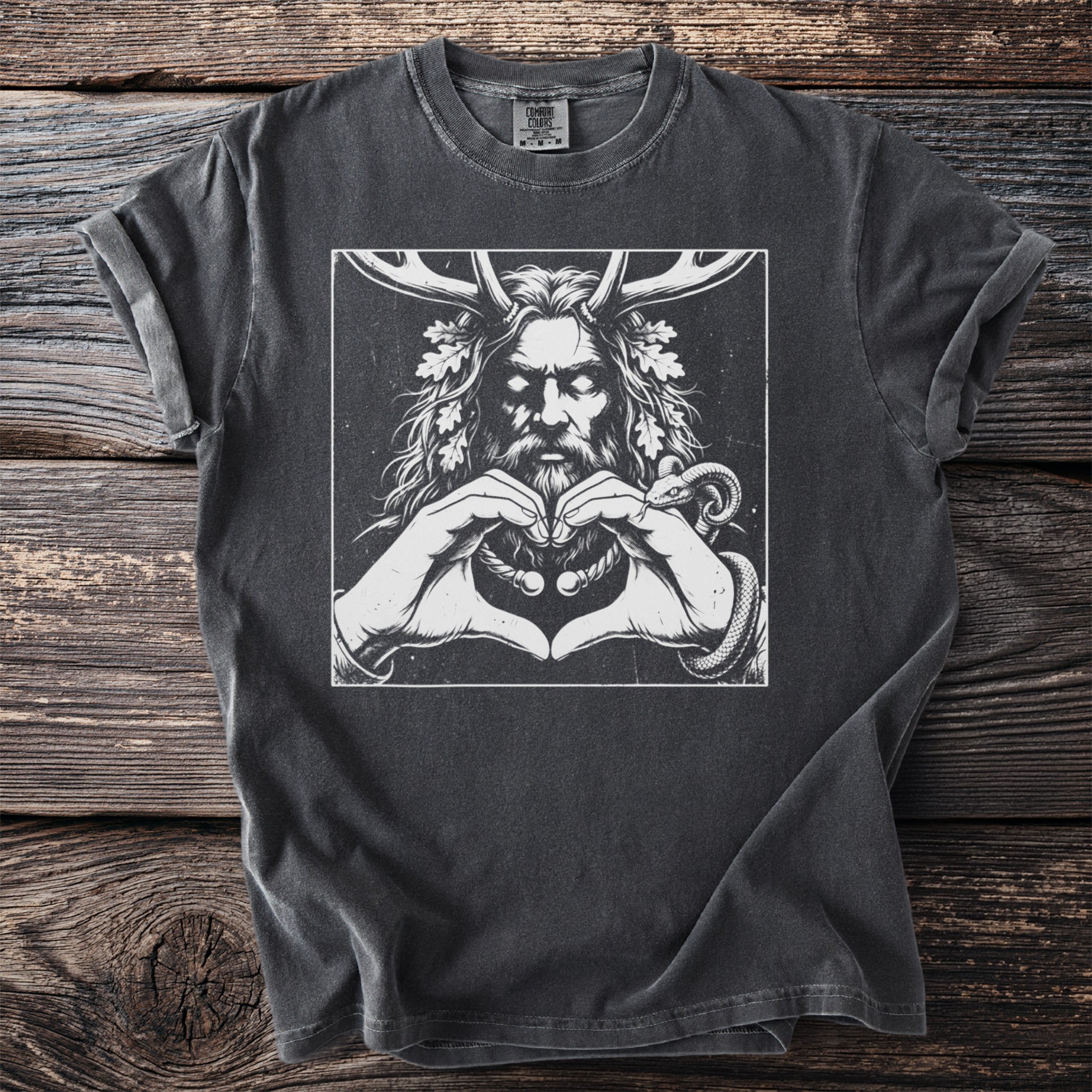 Dark grey t-shirt with white graphic of a horned figure making a heart shape with hands and a snake.