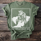 Green Comfort Colors t-shirt with werewolf graphic and "the fitted sheet wor" text.