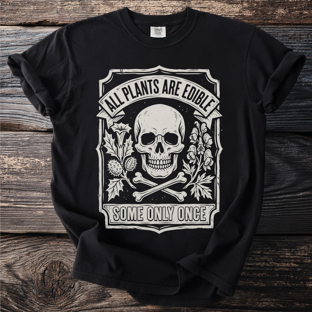 Black t-shirt with skull, bones, plants, "All Plants Are Edible" and "Some Only Once."