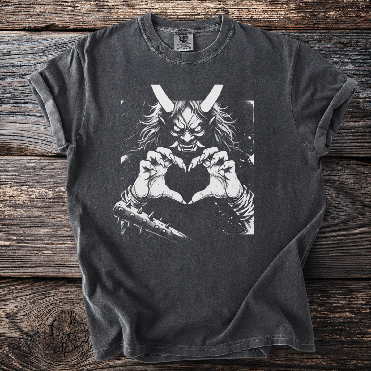 Dark gray t-shirt with a white graphic of a demon making a heart shape with its hands.