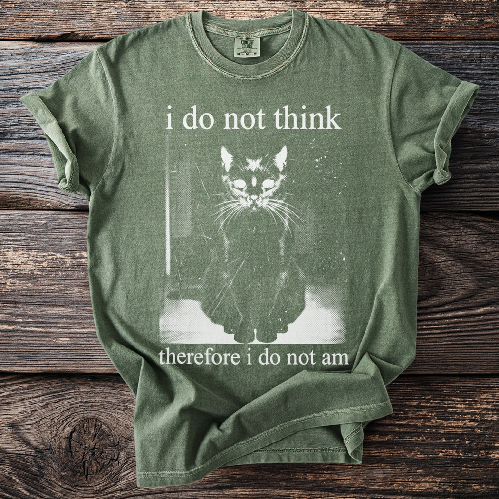 Green t-shirt with a black cat graphic and text "i do not think therefore i do not am".