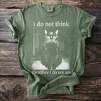 Green t-shirt with a black cat graphic and text "i do not think therefore i do not am".