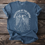Phantom of the Opera graphic on a blue t-shirt with text.