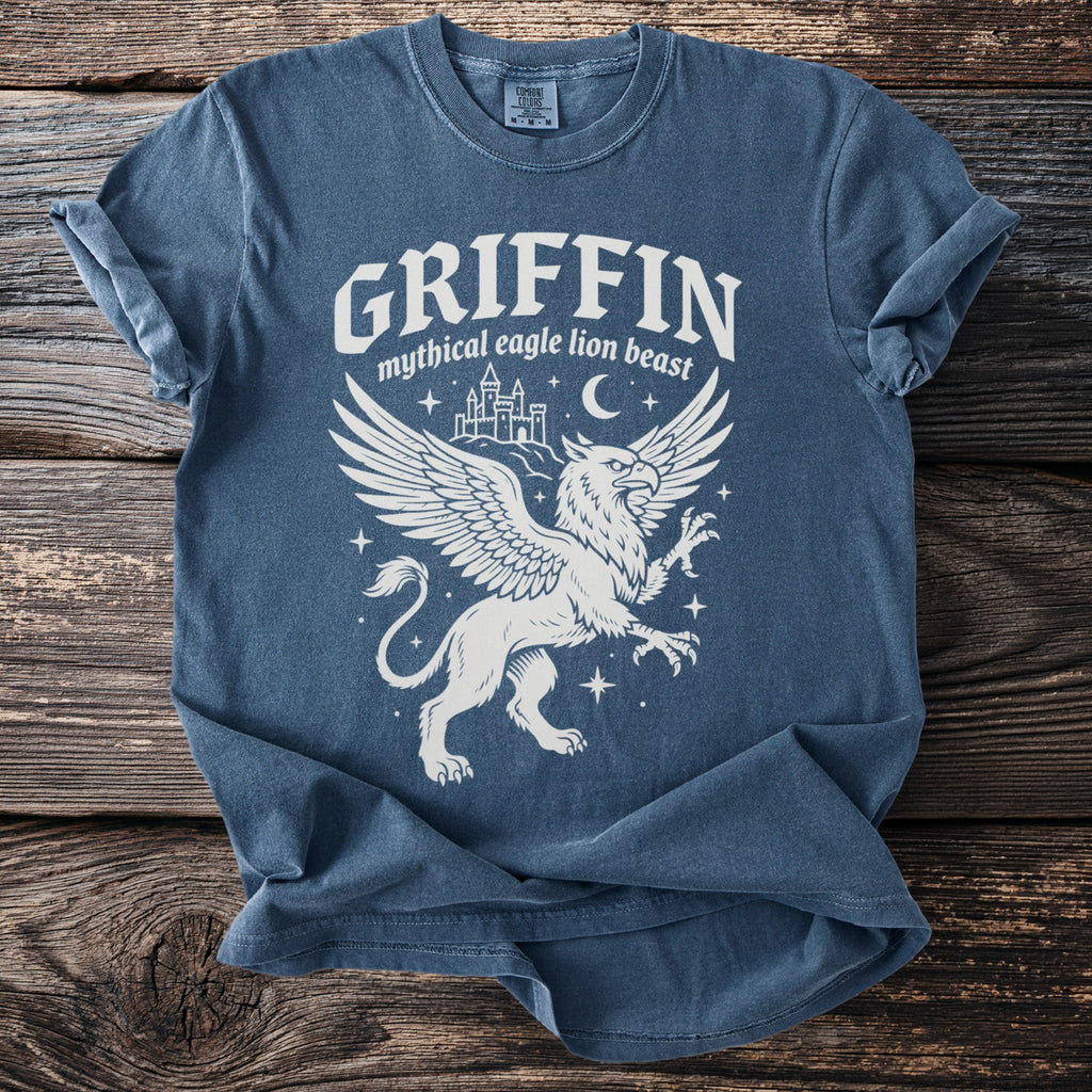 Blue t-shirt with a white griffin graphic and text Griffin Mythical Eagle Lion Beast.