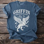 Blue t-shirt with a white griffin graphic and text Griffin Mythical Eagle Lion Beast.