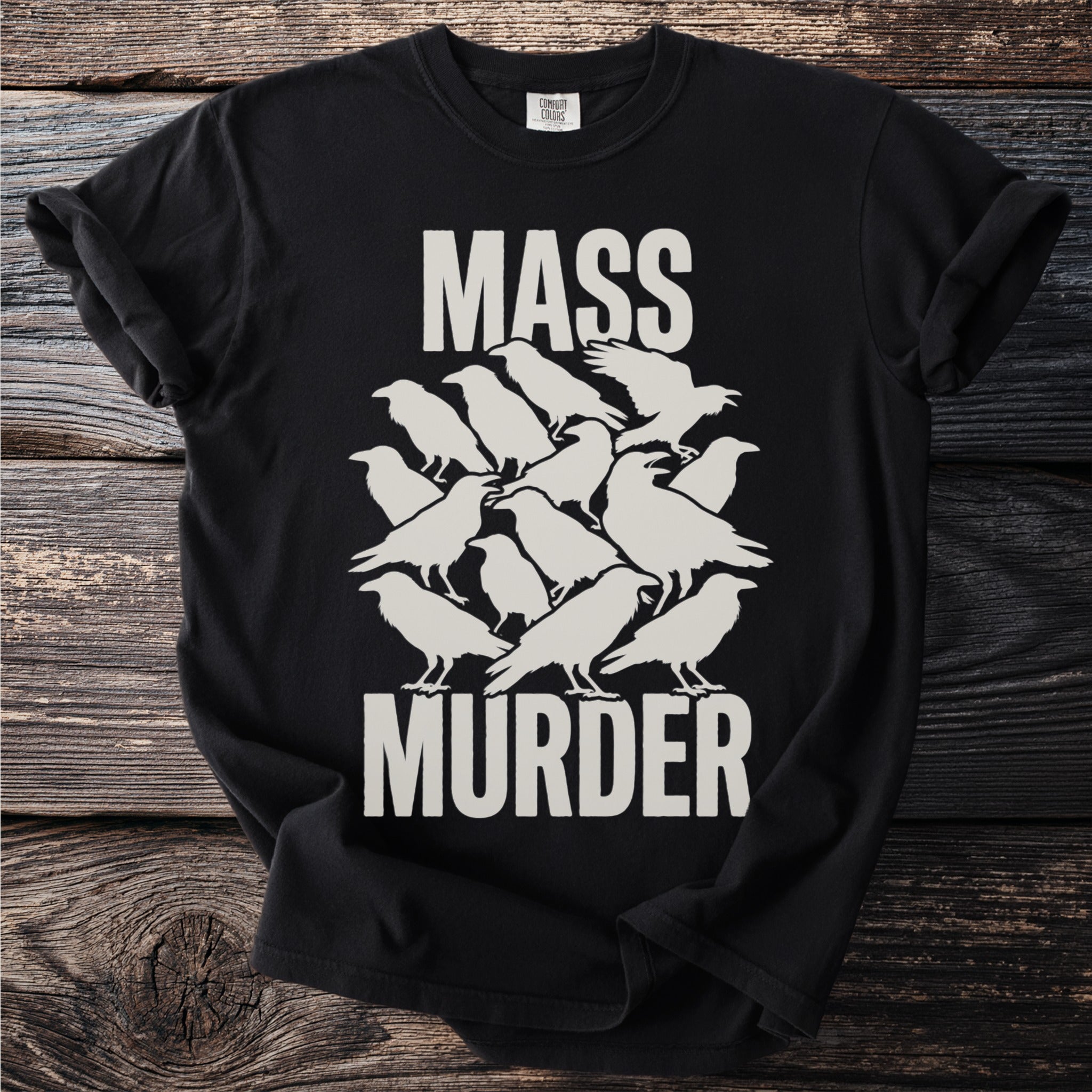 Black t-shirt with white text "MASS MURDER" and a graphic of stacked crows.