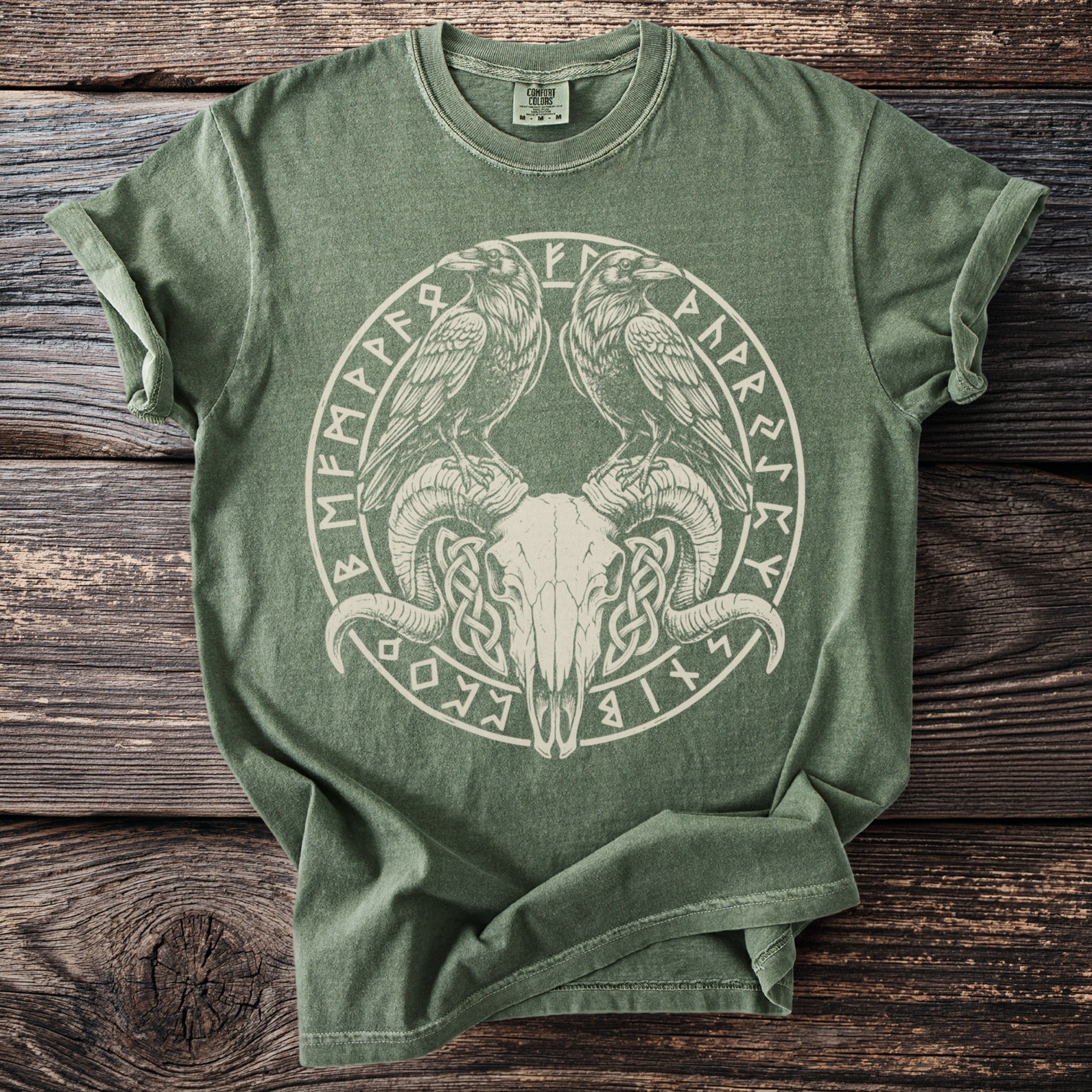 Green t-shirt with circular ram skull, ravens, and rune design.