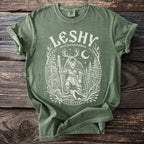 Green t-shirt with white Leshy forest god folklore graphic and runes.