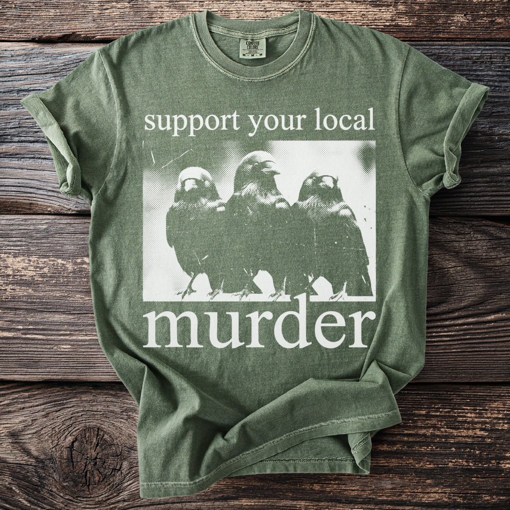 Green t-shirt with "support your local murder" text and three birds graphic.