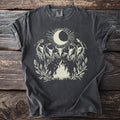 Dark gray t-shirt with white graphic of moon, sun, four skull figures, and campfire.