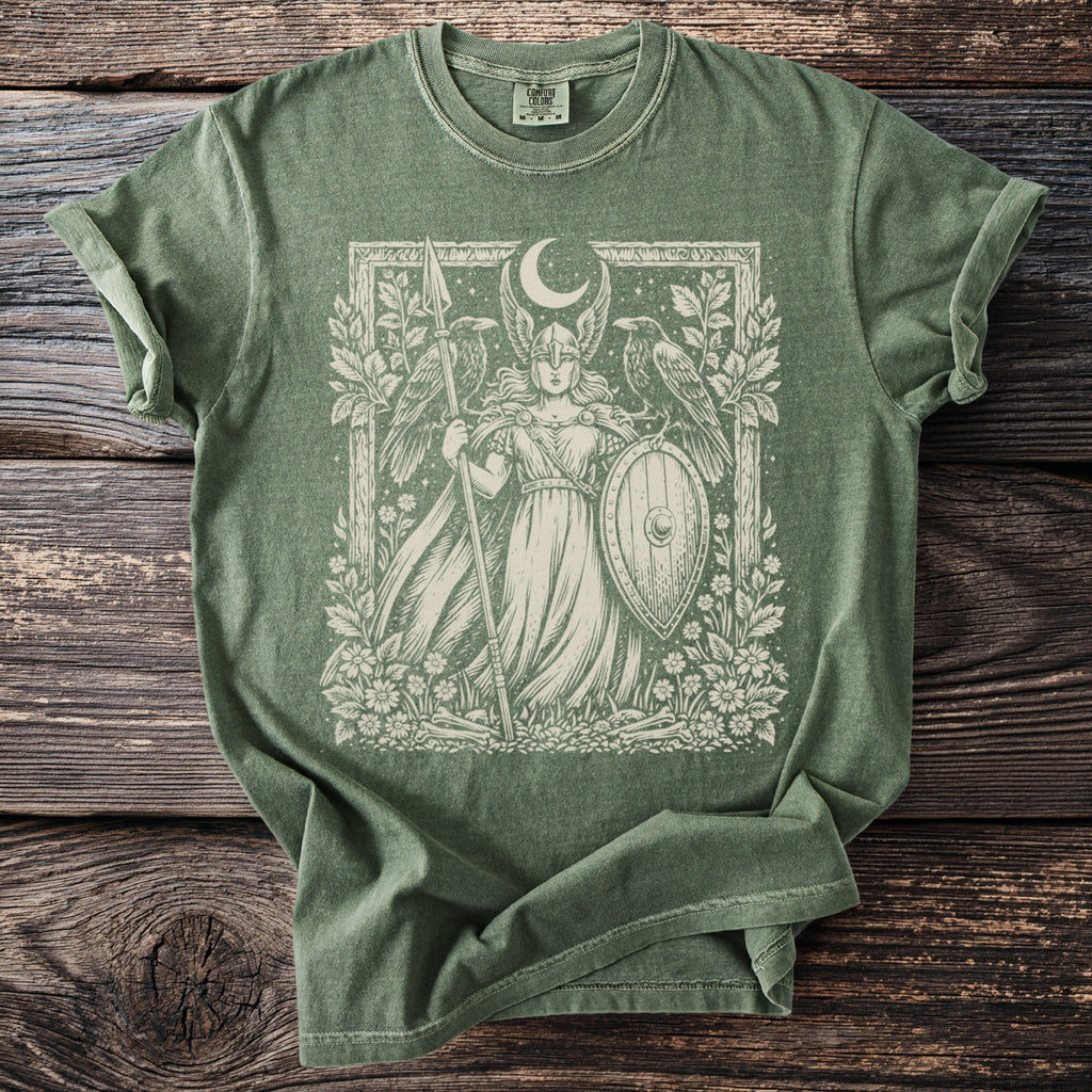 Green t-shirt with a winged warrior, shield, spear, and two ravens illustration.