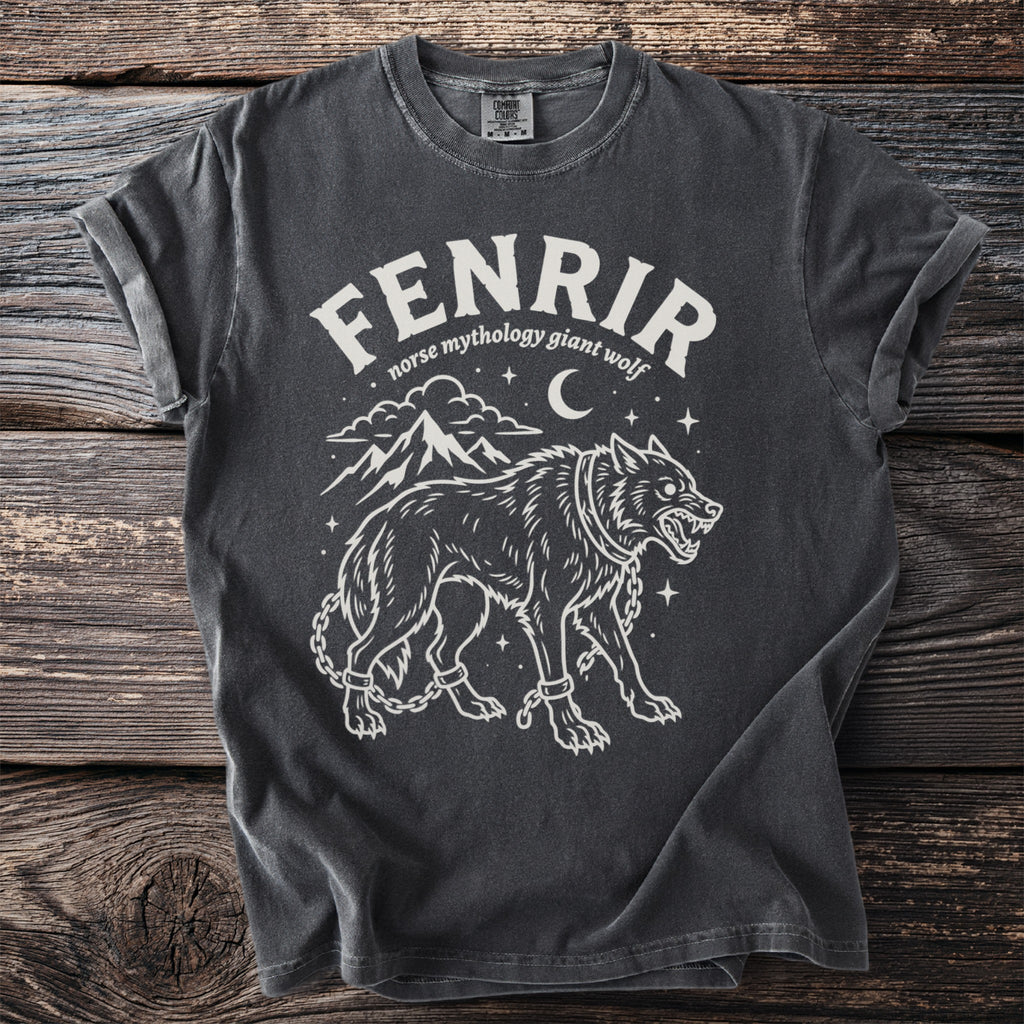 Dark grey t-shirt with white graphic of Fenrir, Norse mythology giant wolf, chained with mountains and moon.