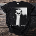 Black t-shirt with a black and white graphic of a startled ostrich and the text "i missed my fligh".