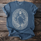 Blue t-shirt with an oval white graphic of a wizard and runes.