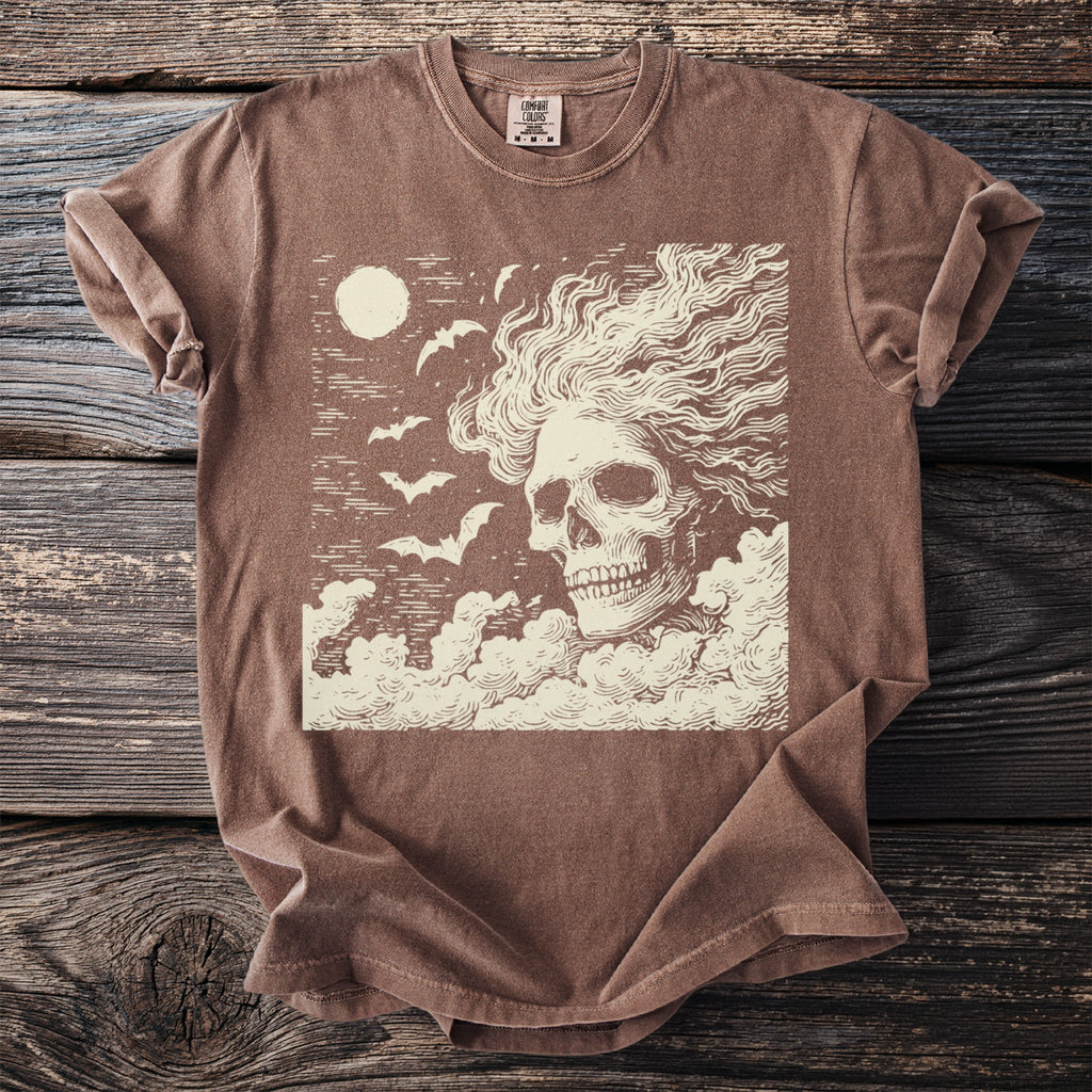 Brown t-shirt with a cream skull, bats, moon, and clouds graphic.