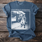 Blue t-shirt with graphic of a werewolf holding ice cream and text "everything is temporary".