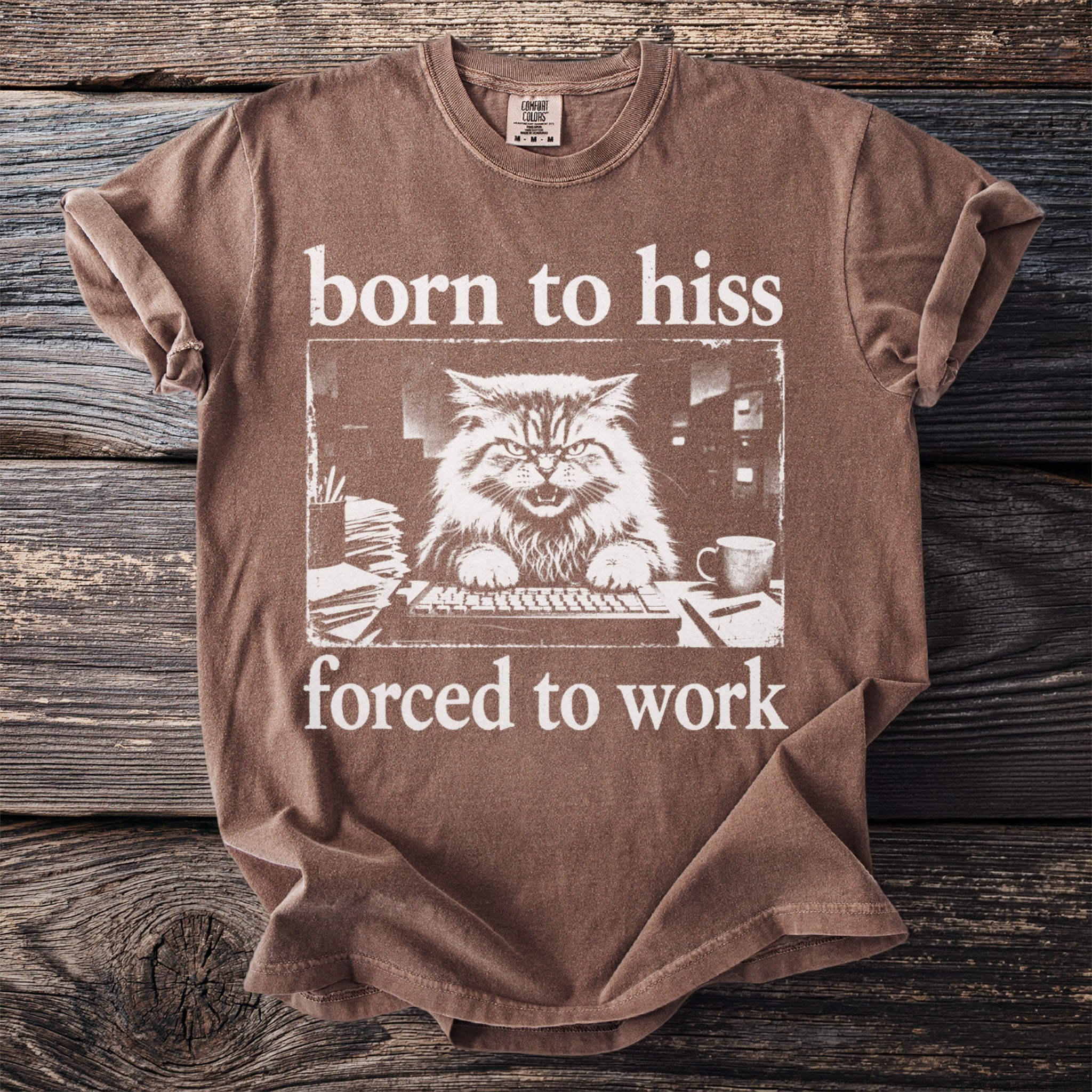 Brown t-shirt with white text and a frustrated cat at a keyboard.