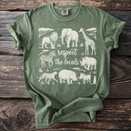 Green t-shirt with safari animals and "respect the locals" text.