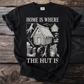 Black t-shirt with "Home is Where The Hut Is" text and a drawing of a hut on chicken legs.