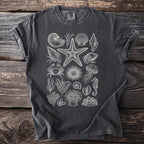 Dark grey t-shirt with a white line drawing of various sea creatures and shells.
