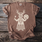 Brown t-shirt with a cream linocut-style print of a shamanic figure.