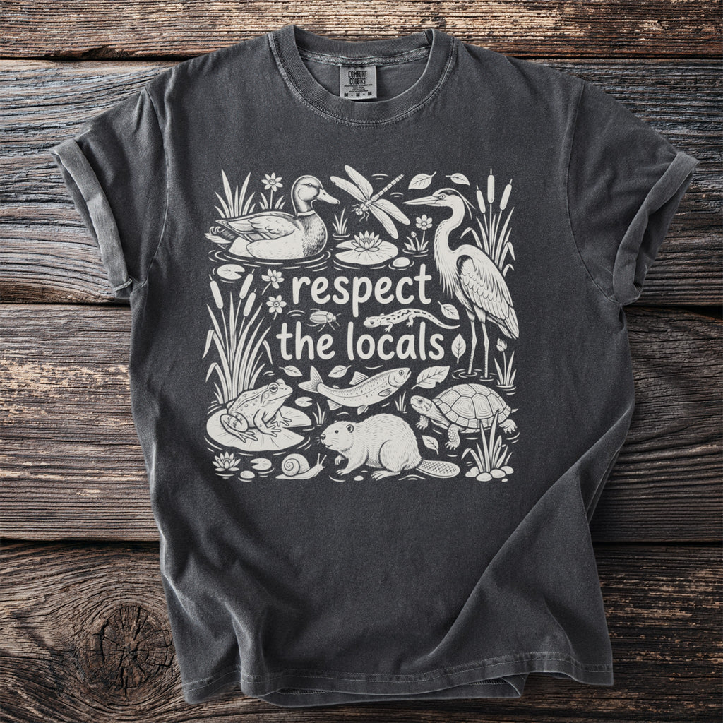 Dark grey t-shirt with "respect the locals" text and wildlife illustration.