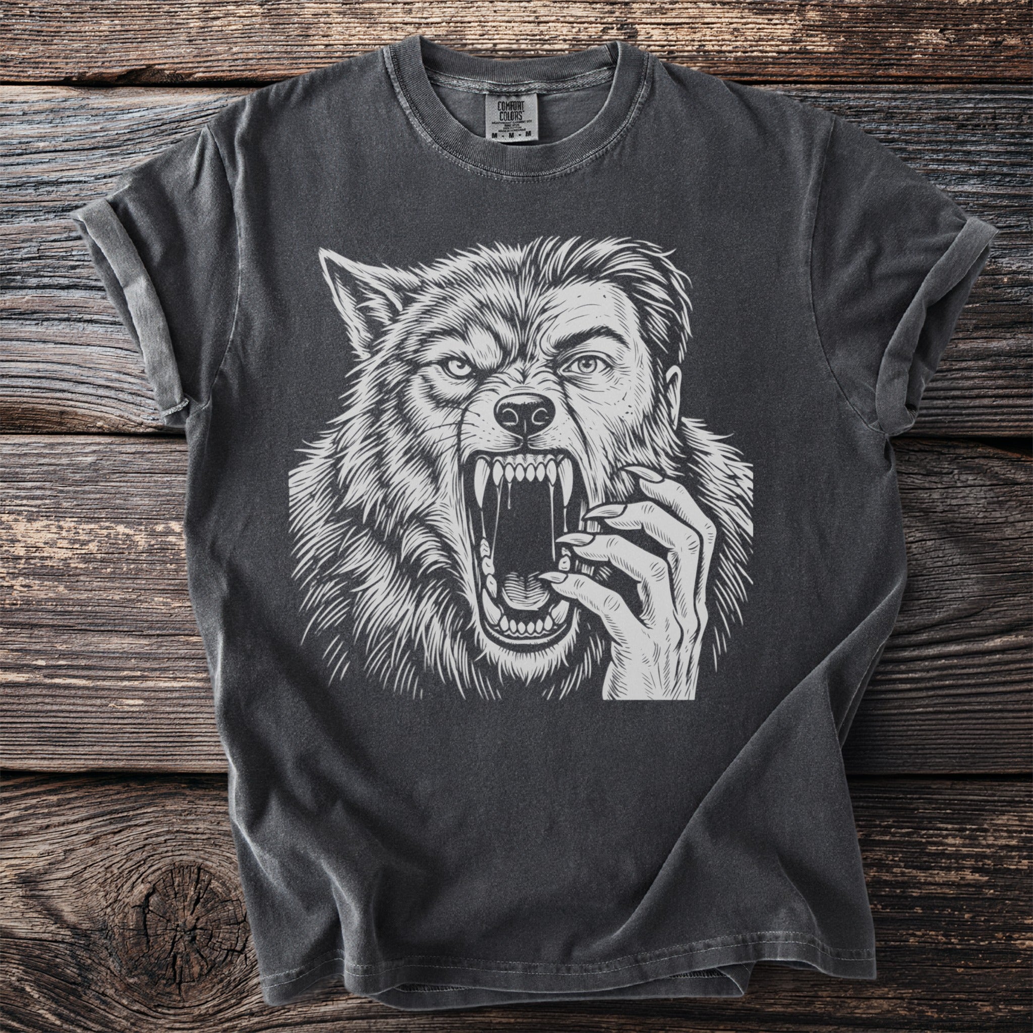 Gray t-shirt with a white werewolf face transitioning into a human face illustration.