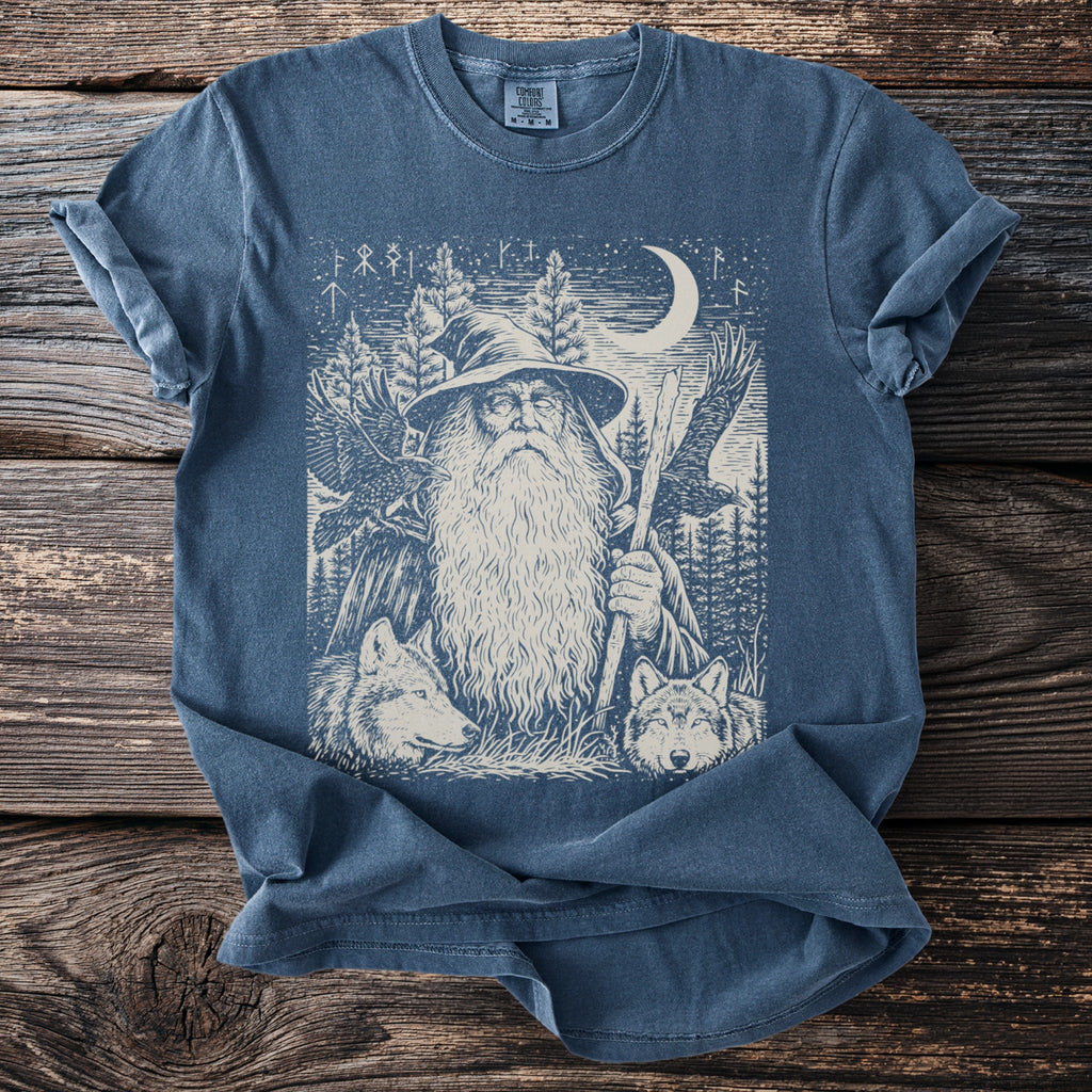 T-shirt with a wizard, wolves, ravens, pine trees, and a moon.