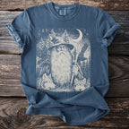 T-shirt with a wizard, wolves, ravens, pine trees, and a moon.