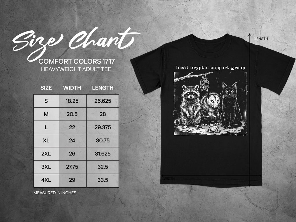 Size chart with measurements and a black t-shirt featuring "local cryptid support group" and animals.