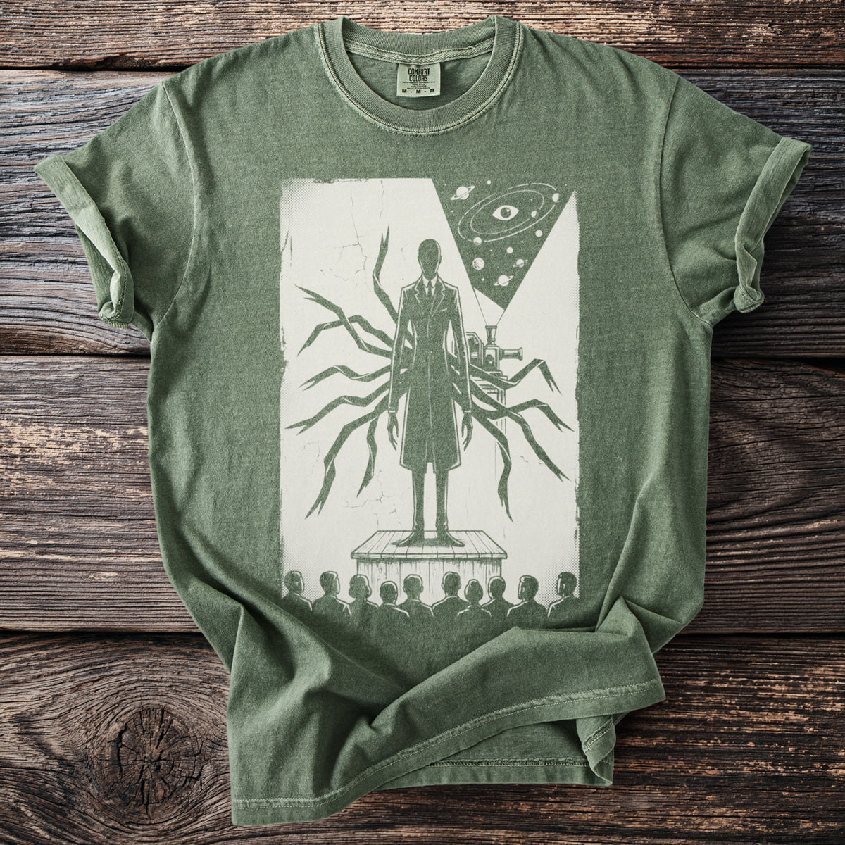 Green t-shirt with a surreal illustration of a figure with many arms and a telescope.