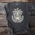 Charcoal t-shirt with a cream graphic of Medusa surrounded by snakes and laurel leaves.