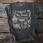 Dark gray t-shirt with white line art of mushrooms, a snail, fern, and text "respect the locals".