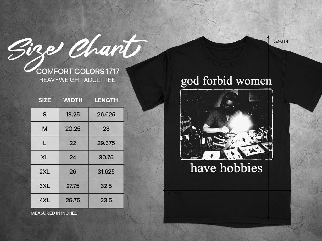 Black t-shirt with "god forbid women have hobbies" text and a graphic against a size chart.