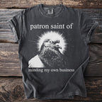 T-shirt with pigeon image and text "patron saint of minding my own business".