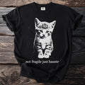 Black t-shirt with a kitten graphic and text that reads "not fragile just haunted".
