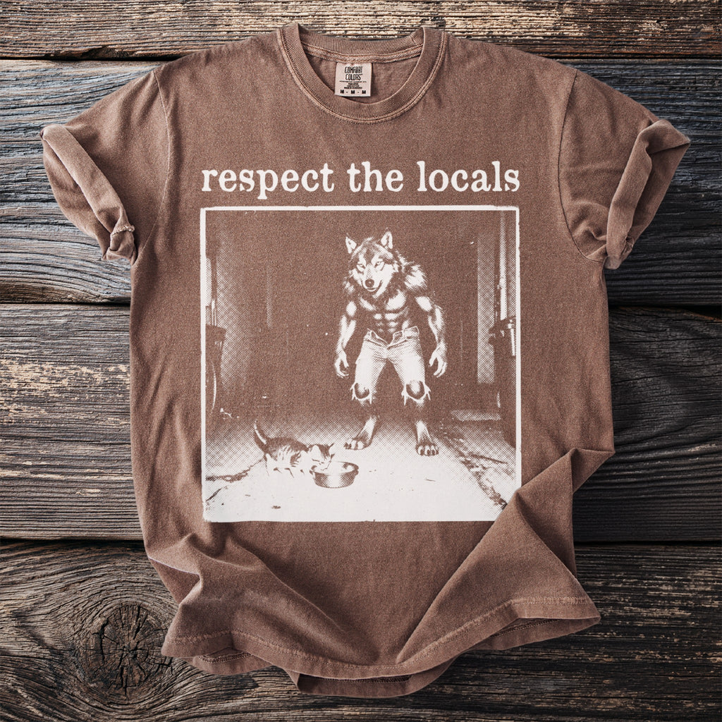Brown t-shirt with graphic of a werewolf and a kitten, reading "respect the locals".